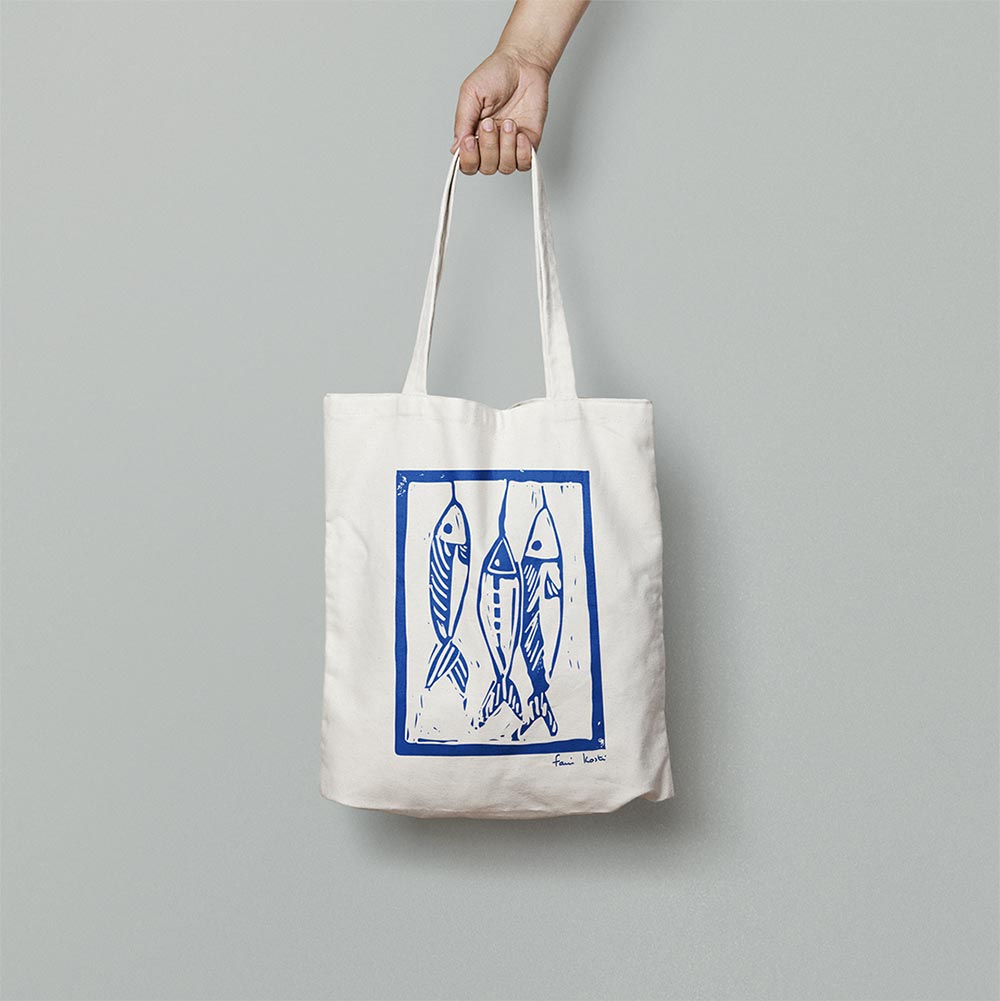 beyond frames has launched the creation of a white tote bag with three vertical blue fish designed by the French artist Fani Kosti